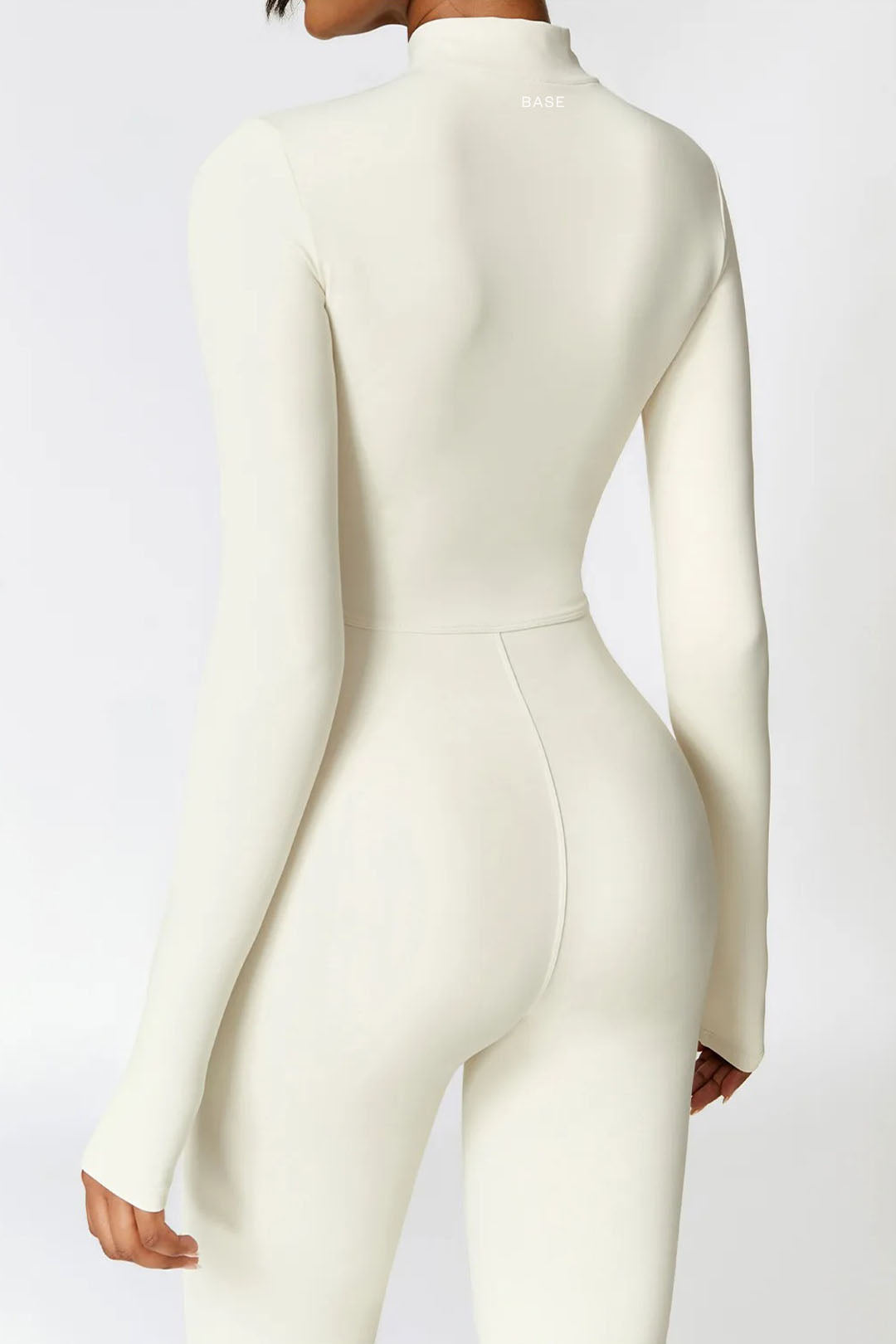 Soft Sculpt Long Sleeve Mock Zip Jumpsuit by BASE BODY.